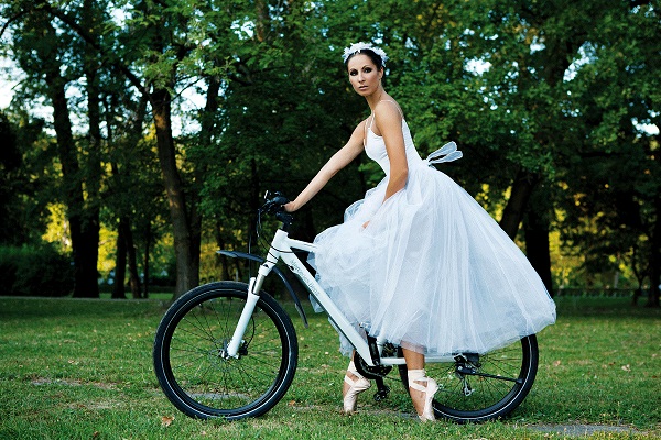 Pictured: Ballet dancer Olga Olcan on a bicycle. Photo Credit: Dina Johnsen.