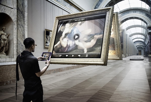 An image of a man looking at a digital semblance of a painting, which mimics the one on his tablet screen as seen in the series “Art Game” by photographer Léo Caillard. Photo Courtesy Of: Léo Caillard.