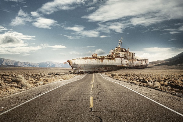 An image of a boat that has rusted and withered away, which is from the series “War Game” by photographer Léo Caillard. Photo Courtesy Of: Léo Caillard.