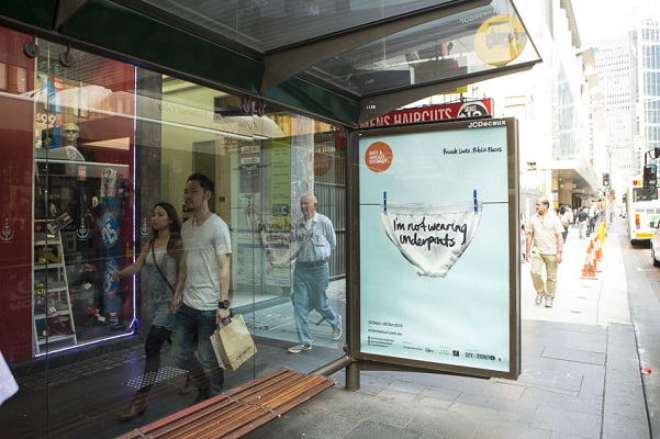 A piece from the project "City Lights," with the secret "I'm not wearing underpants" is displayed at a Sydney bus stop. Photo Courtesy of: Alphabet Studio.