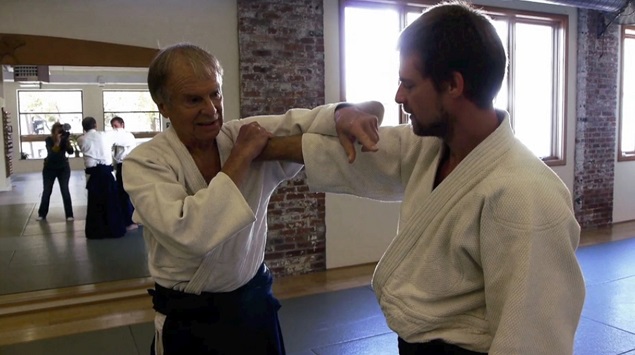 Ed Pincus practices Aikido with his son, Ben. Photo: Lucia Small.