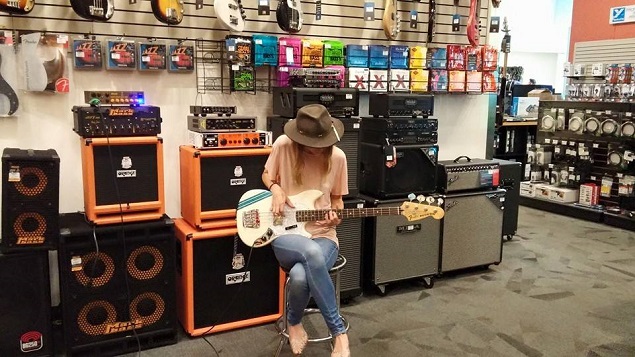 Emily Haine was seen purchasing her first bass on July 22. Photo Credit: Emily Haine/Facebook.